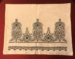 Decorative cushion cover with very detailed black and white embroidery