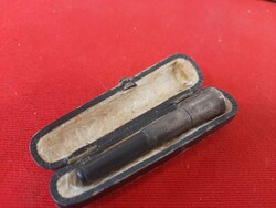 Old marked silver-tipped earring in its box.
