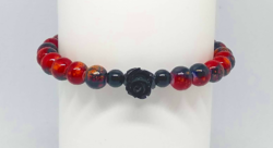 Red-black beaded bracelet with a black carved rose pendant