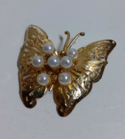 A gold-plated butterfly-shaped openwork brooch in beautiful condition, studded with pearls
