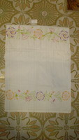 Old embroidered home-woven towel, decorative towel with a crochet border
