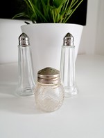 Three salt or pepper holders, salt shakers and pepper shakers together