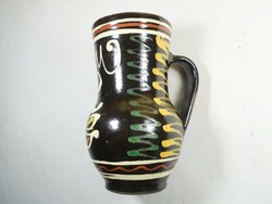 Old retro ceramic vase with flower pattern folk folk art