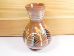 Old retro ceramic vase with flower pattern folk art