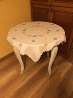 A very old tablecloth with appliqué embroidery