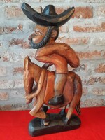 Mexican man on horse wood sculpture