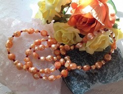 Real room. Unique shell pearl necklace with coral pearls