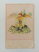 Old postcard with a picture of a small boy, dog and cat