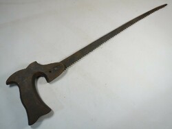 Antique old saw wood saw carpentry industrial tool from the early 1900s