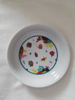 Hand-painted children's plate with fish and vegetables