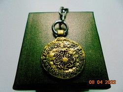 Golden pendant with the inscription 