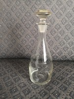 Torn, engraved, vintage glass bottle with stopper