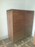 A cabinet with shuttered drawers and index cards