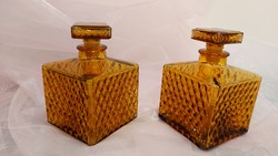 A pair of Japanese amber-colored corked bottles