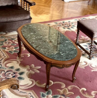 Coffee table on wooden neobark legs with marble inlay.