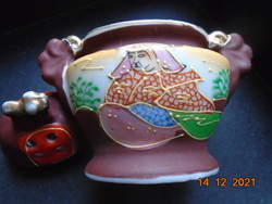 Satsuma moriage oval incense with a small dragon dog on the lid and a hand-painted rakan portrait