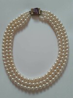 Very nice three-row tekla (plastic) necklace with a decorative clasp
