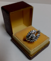 A hallmarked sterling silver ring in beautiful condition with many white faceted set white stones