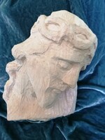 Carved wooden head of Christ