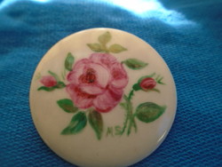 Old porcelain brooch hand-painted with the signature of a master