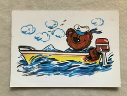 Postcard with a teddy bear motorboat