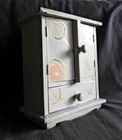 Shabby cupboard with shelves and drawers