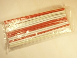 Old retro plastic straw in white, red, stripes from the 1980s