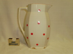 Old granite jug with red dots