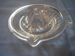 Antique lemon squeezer in a thick-walled glass