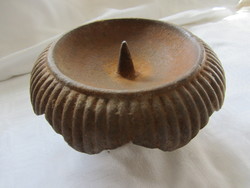 Remains of a cast iron candle holder