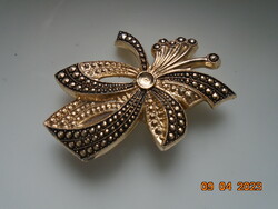 Niellos gold tone brooch with marcasite