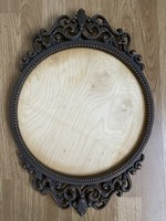 A large round bronzed metal picture frame for a mirror is a beautiful piece for anything.