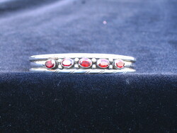 Solid silver bracelet with burgundy stones