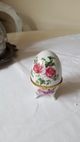 Pink, egg-shaped porcelain box with jewelry holder