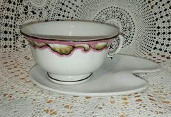 Porcelain tea cup with saucer.