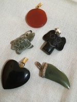 Carved mineral pendants.