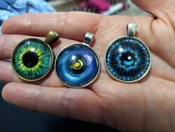 Bronze and silver-plated pendants, amulets with eye glass lenses