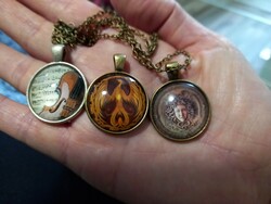 Bronze and silver-plated pendants, amulets with glass lenses
