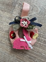 Easter decoration with bunny wax, bow and ribbon ornament