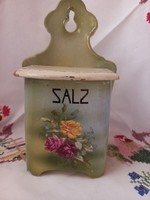 Wall-mounted salt shaker with pink decor