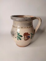 Old small painted folk earthenware pot with flowers