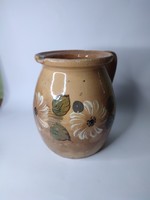 Old painted folk earthenware pot with silk flowers