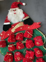 Advent calendar with Santa Claus in green tones with felt bags