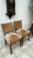 Art deco style upholstered chairs in a pair