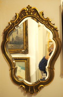 Carved, gilded wall mirror