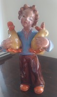 Ceramic statue of a girl with ducks