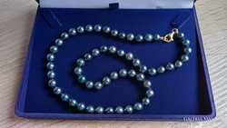 Blue saltwater cultured pearl string with gold fittings