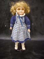 Porcelain head doll with blonde sunglasses