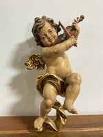 Fiddling putto angel face wall decoration