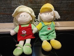 Two smiling doll toy figures in a pair